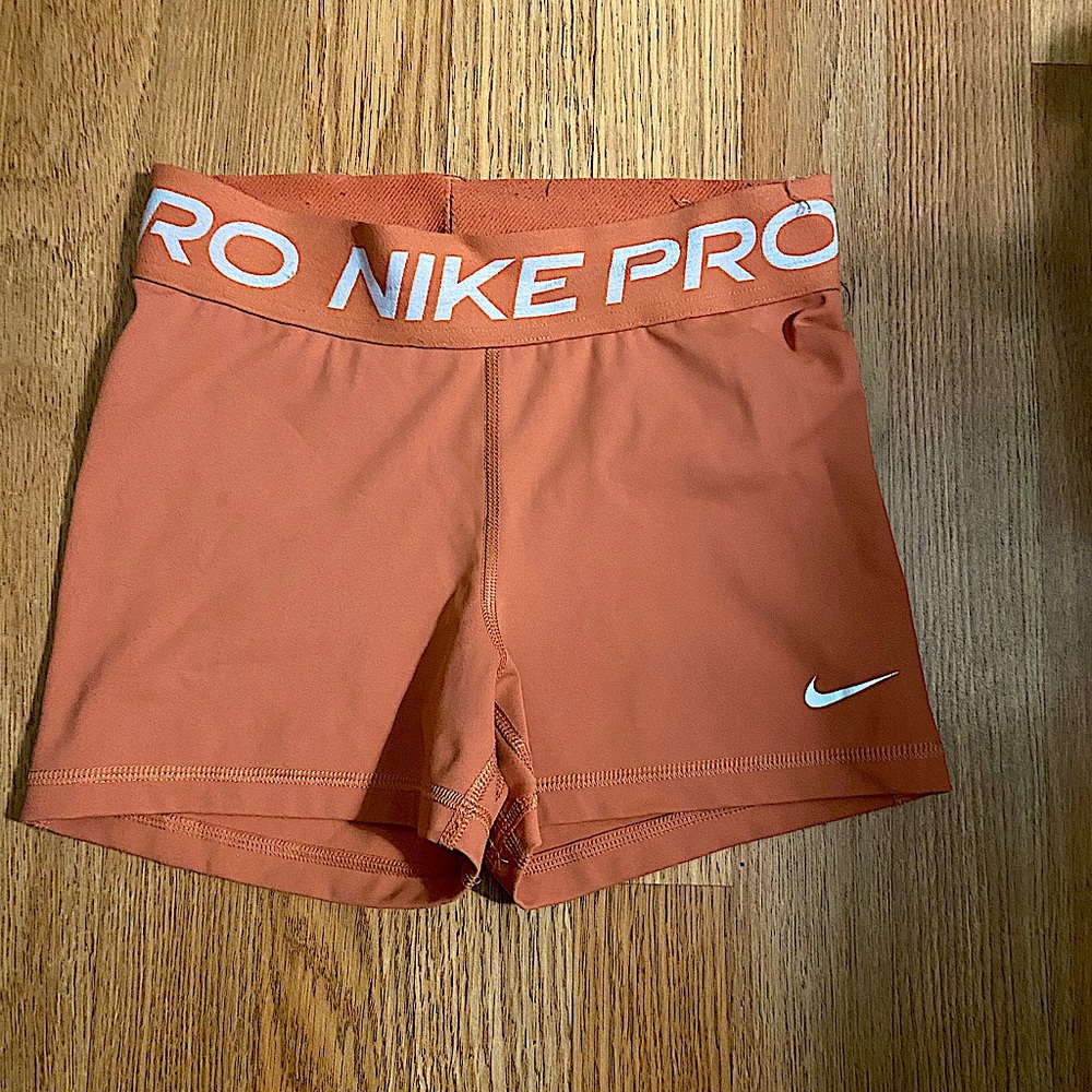 Orange Nike pros